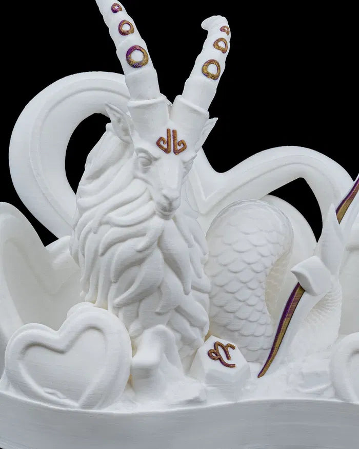 White sculpture of a Capricorn with large horns and decorative elements on a black background