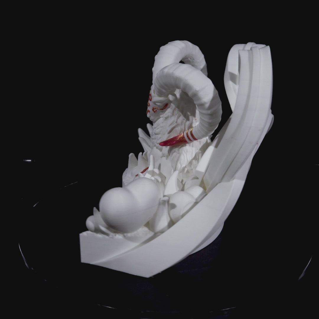 White sculpture of a Capricorn with large horns and decorative elements on a black background
